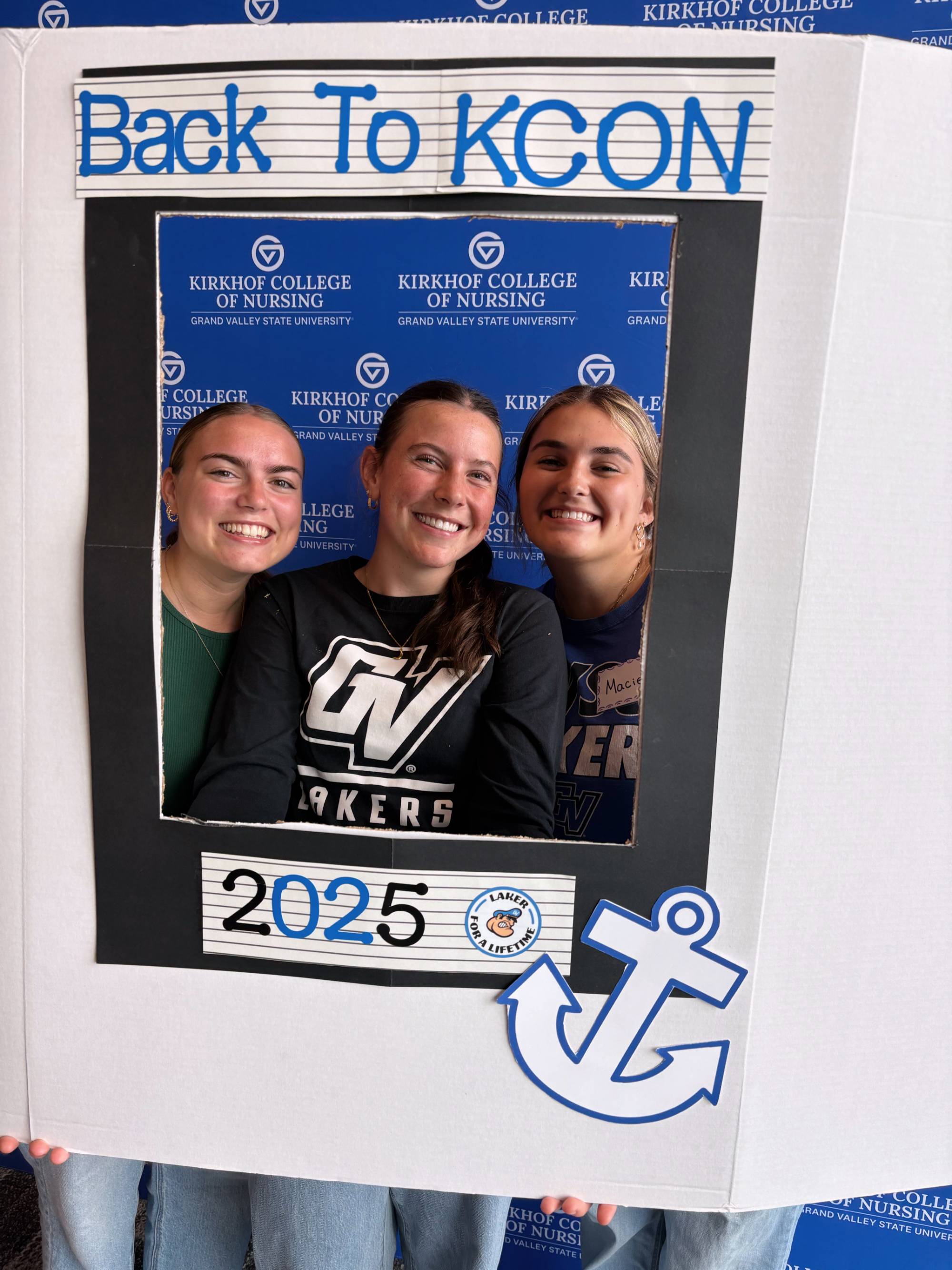 3 young women framed by a sign that says "Back to KCON 2025"